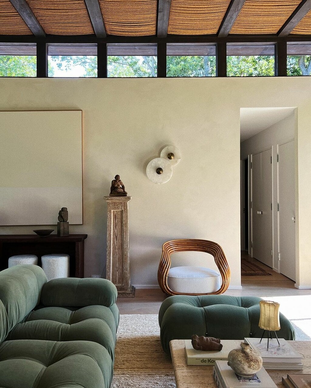 @eyeswoon shows how to add color to a room with accessories by using green furniture in a neutral home. 