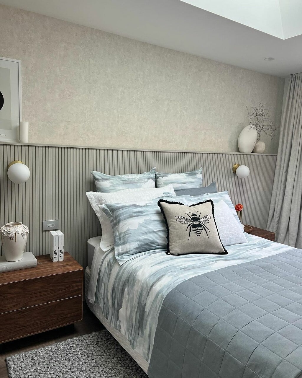 colourful cushions on a neutral bed by Stacy Heyman. 