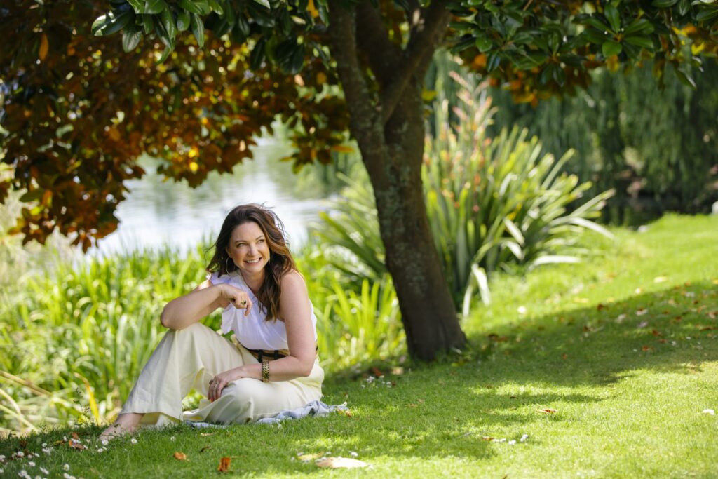 Claire Chitham wearing white top and beige pants