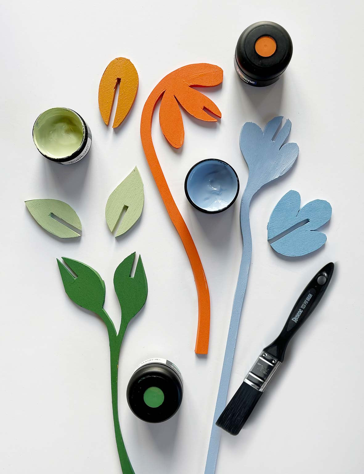 wooden flower cutouts painted bright colours